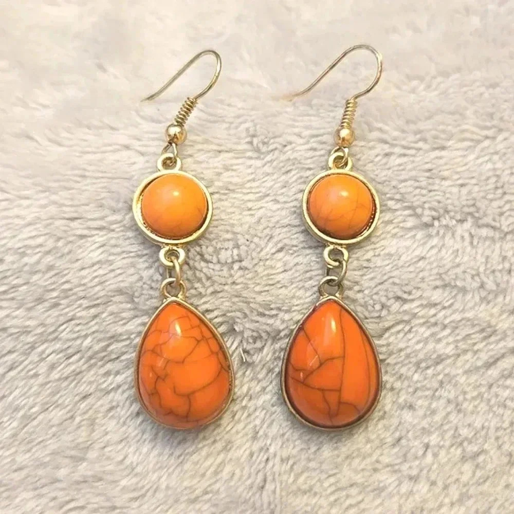 #403 Gold tone and orange earring